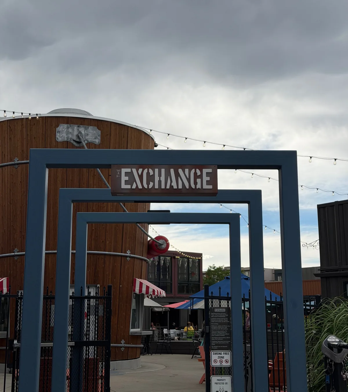 The Exchange entrance beneath string lights in North Old Town Fort Collins