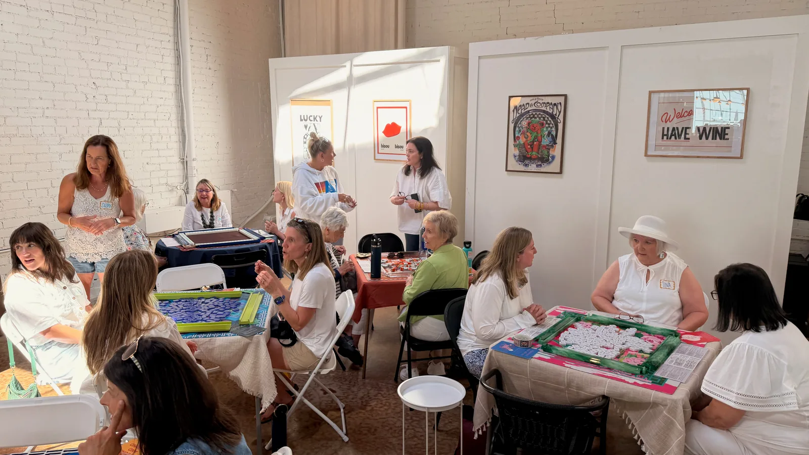 FoCo Mahjong players gathered around several tables inside The Neighbor